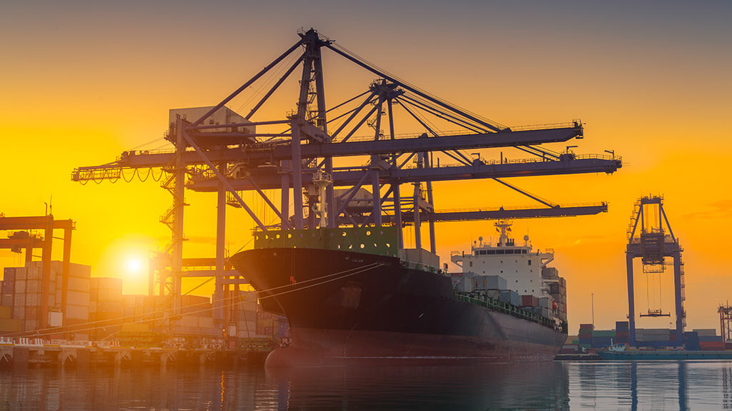 Cargo ship at sunset