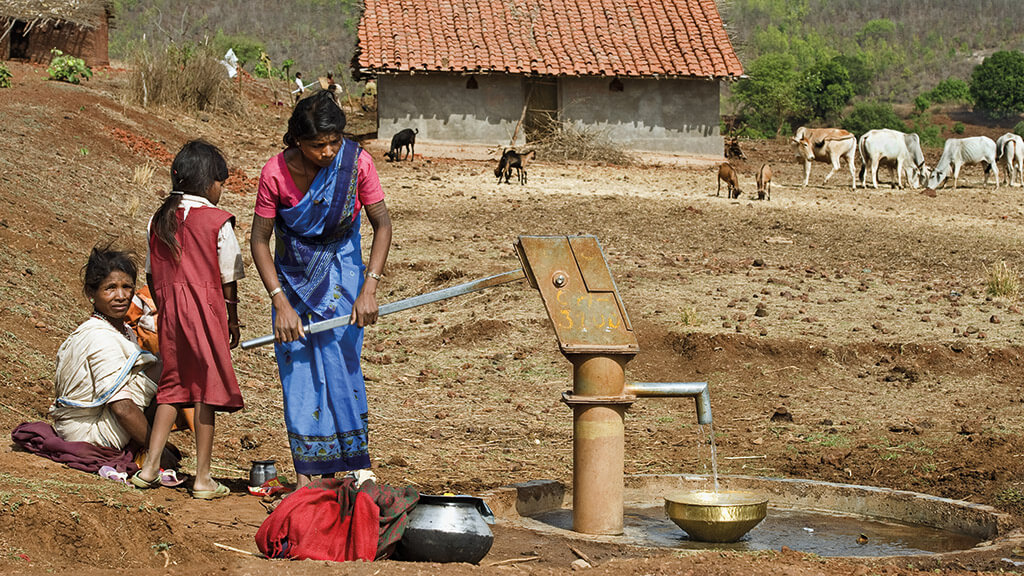 India - Women Pumping Water