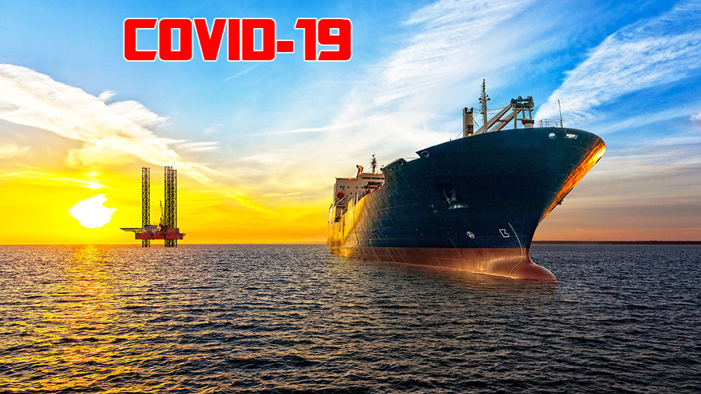 Oil tanker at sea, platform in background
