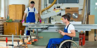 Man with disability working in factory