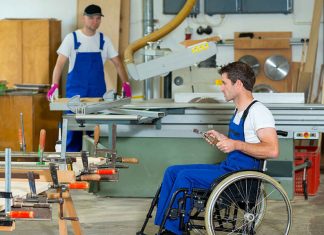 Man with disability working in factory