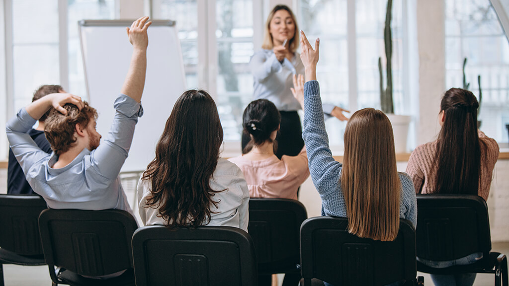 Female speaker, training class, skills gap