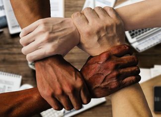 Social investment. Diversity, inclusion. Hands linked, ethnicity