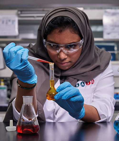 Tamer Group, female scientist working in laboratory