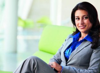 Woman in formal business wear, sitting