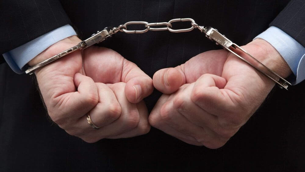 Businessman in handcuffs. Covid scheme fraud illustration