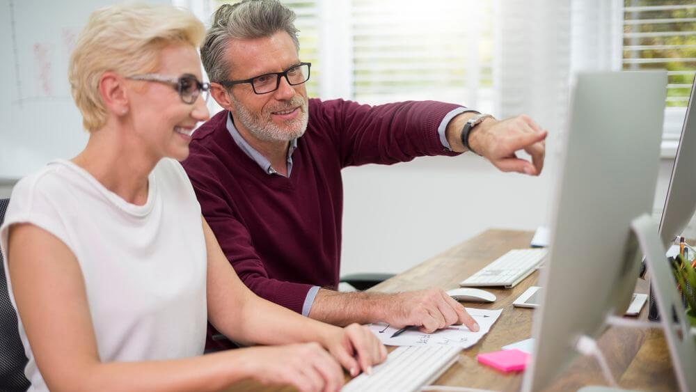 Man and woman in office, older workers illustration